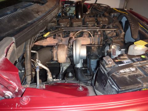 1997 Dodge 2500 - Close-up view of a diesel engine, highlighting the turbocharger and associated components.