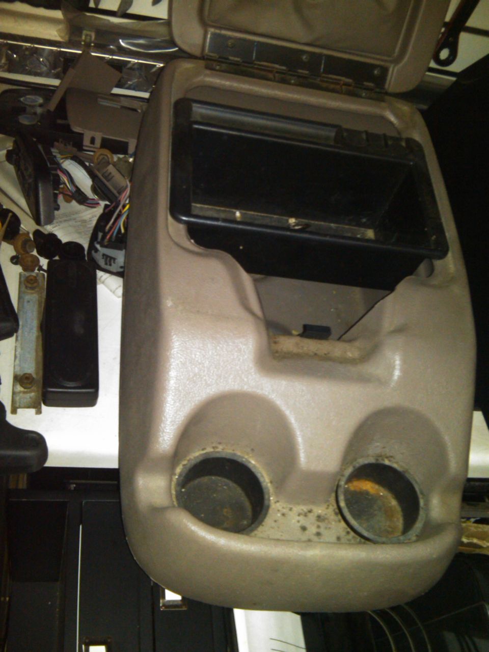 Center console part with two cup holders and open storage compartment