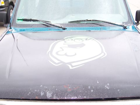 1987 Ford Ranger - The hood of a truck features a large decal of Peter Griffin, with turquoise trim visible around the windshield.
