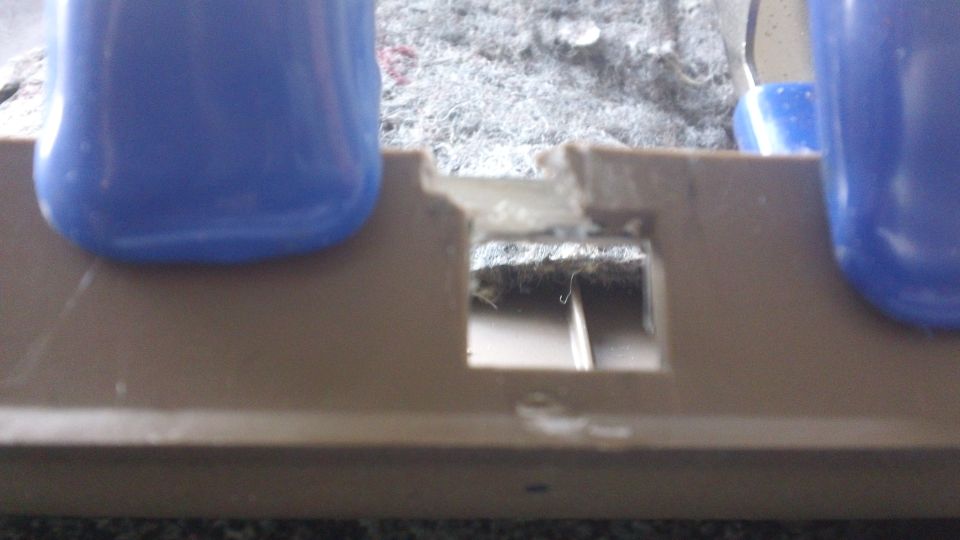 Interior door panel damage with blue plastic trim