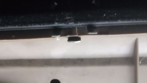 1994 Ford Bronco - Close-up of a 1994 Ford Bronco's door latch mechanism, showing internal components.
