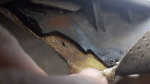 1994 Ford Bronco - Interior door panel damage is visible, with worn fabric and cracked plastic components.