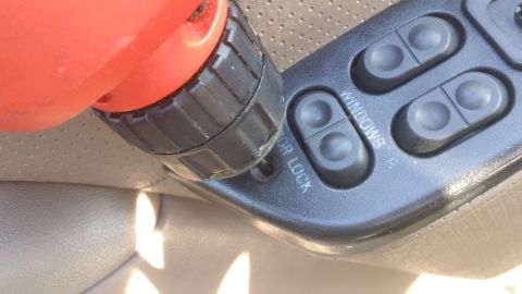 1994 Ford Bronco - Close-up of the interior door panel controls on a 1994 Ford Bronco.