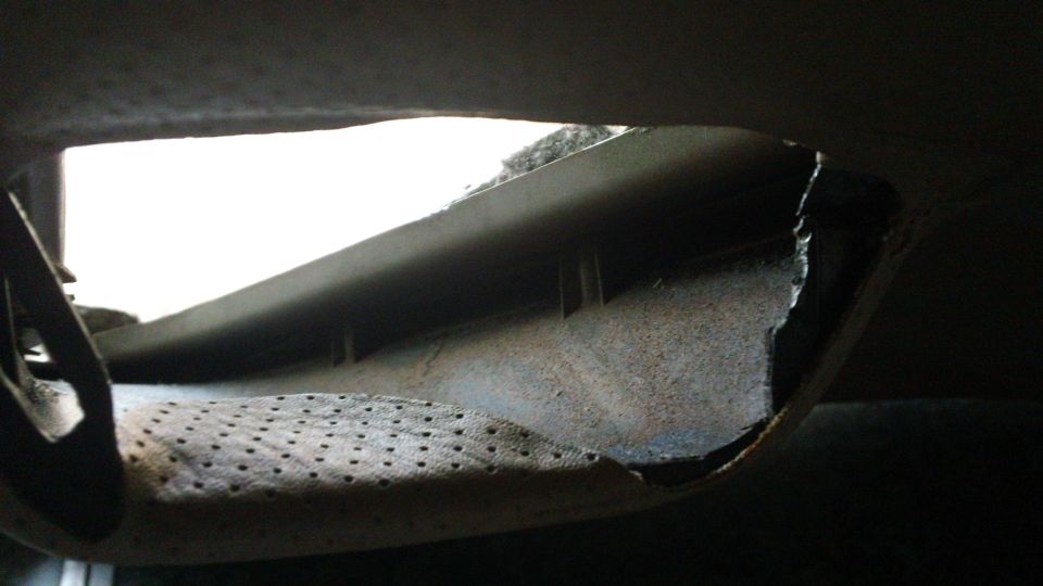 Interior panel damage with visible Supermotors.net logo