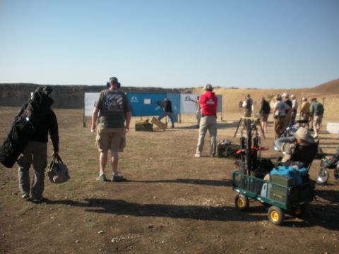 1996 Ford Bronco - A group of people are participating in an outdoor shooting event with targets in the background.