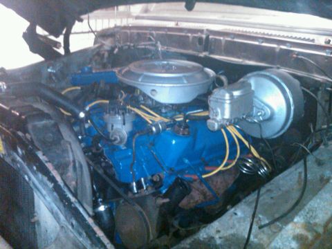 1979 Ford Bronco - Close-up view of a vehicle's engine bay, showing the engine and associated components.