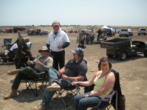 1996 Ford Bronco - A group of people enjoy a day at the shooting range, with several vehicles visible in the distance.