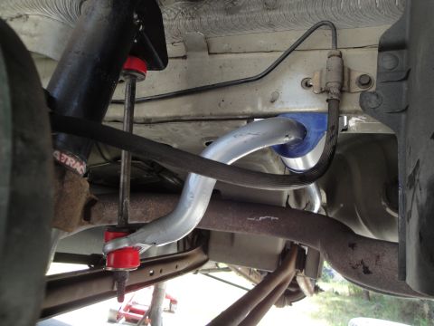 2003 Ford Taurus - This image shows the underside of a vehicle, focusing on the suspension system and exhaust components.