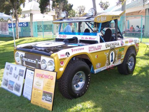 1990 Ford Bronco - This heavily modified Ford Bronco, known as "Big Oly," is displayed with informational boards detailing its racing history.
