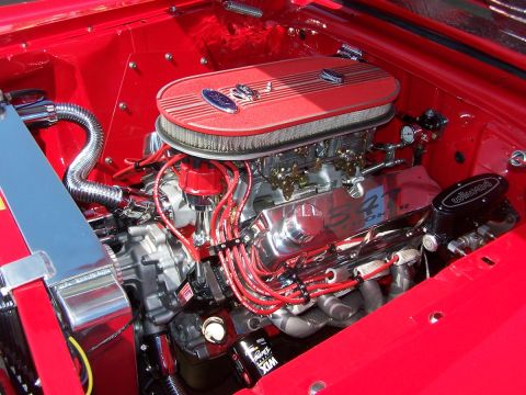 1990 Ford Bronco - Custom Ford V8 engine with performance parts, including dual carburetors and a chrome air cleaner.
