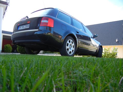 2003 Audi A6 - This dark blue Audi A6 Avant wagon displays a license plate indicating the year 2006.