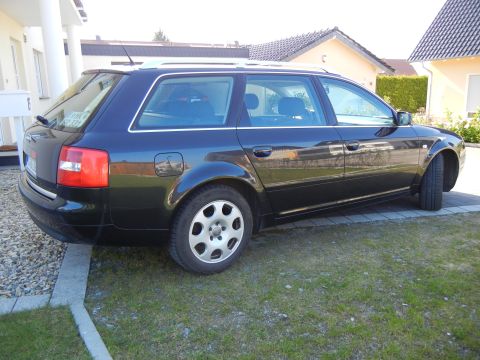 2003 Audi A6 - This black Audi A6 Avant is parked in a residential area. The vehicle appears to be a 2003 model.
