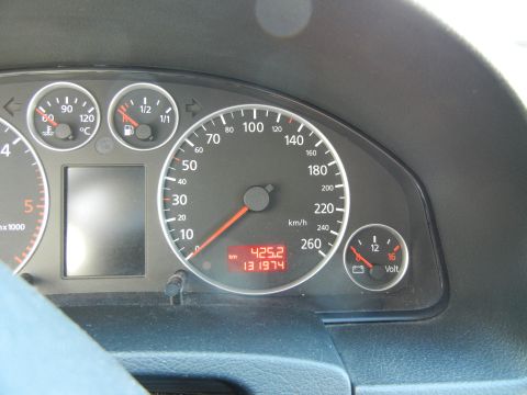 2003 Audi A6 - The dashboard displays the vehicle's speed, fuel level, engine temperature, and voltage, along with odometer readings.