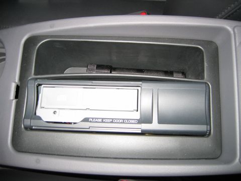 2002 Ford Taurus - 6 Disc changer in center console easy access part of Mach stereo system