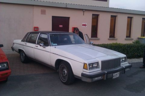 1991 Ford LTD Crown Victoria - This Buick LeSabre features a distinctive grille and a two-tone paint scheme with a black vinyl top.