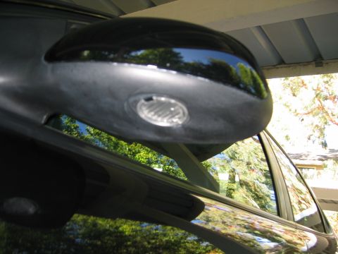 2002 Ford Taurus - "approach" lights under outside mirrors - one of the coolest options runs close 2nd to the Mach Stereo