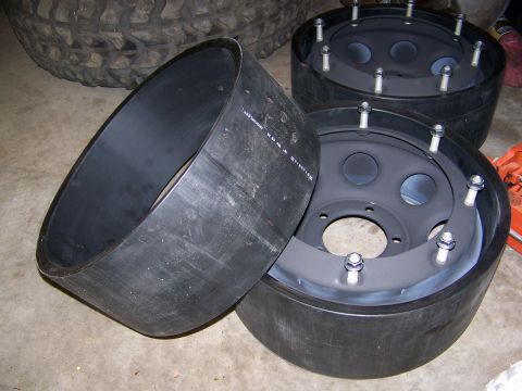2001 Dodge 1500 - Tire inserts and wheels are laid out on a concrete floor.