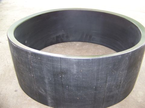 2001 Dodge 1500 - A close-up view of a cylindrical metal part with a textured surface and a polished rim.