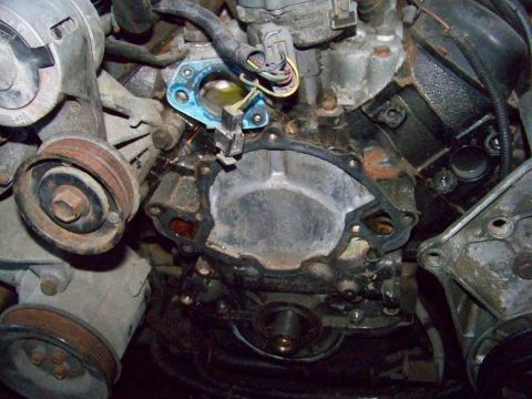 1978 Pontiac Trans Am - Close-up view of an engine's water pump area, showing the removed gasket and surrounding components.
