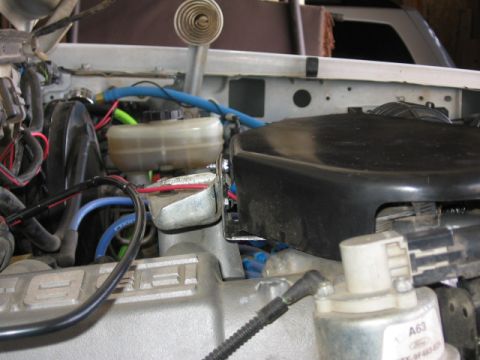 1995 Ford Bronco - Engine bay components including air intake and brake fluid reservoir are visible in this close-up shot.