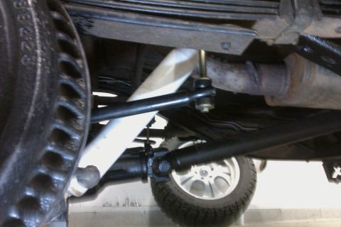 1994 Chevrolet Blazer - Underbody view of rear suspension components, including leaf springs and shock absorber.