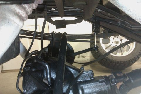 1994 Chevrolet Blazer - Close-up view of a vehicle's undercarriage, focusing on the rear axle and suspension system.