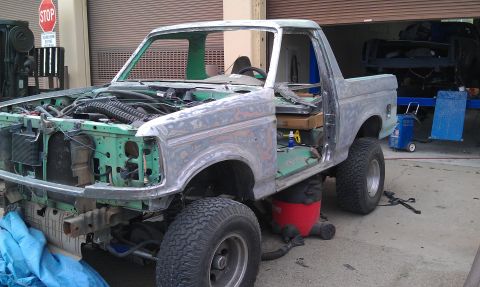1995 Ford Bronco - This Ford Bronco is undergoing bodywork, with its interior and engine bay exposed.