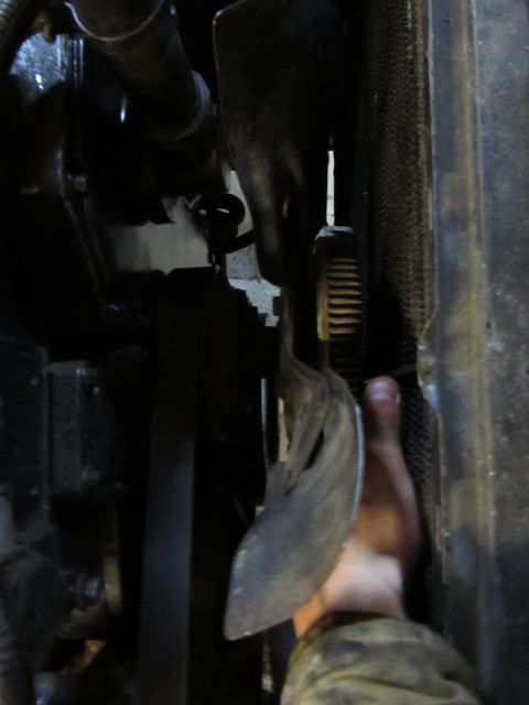 1984 Ford Bronco - Close-up view of a vehicle's engine bay, focusing on the fan and radiator assembly.