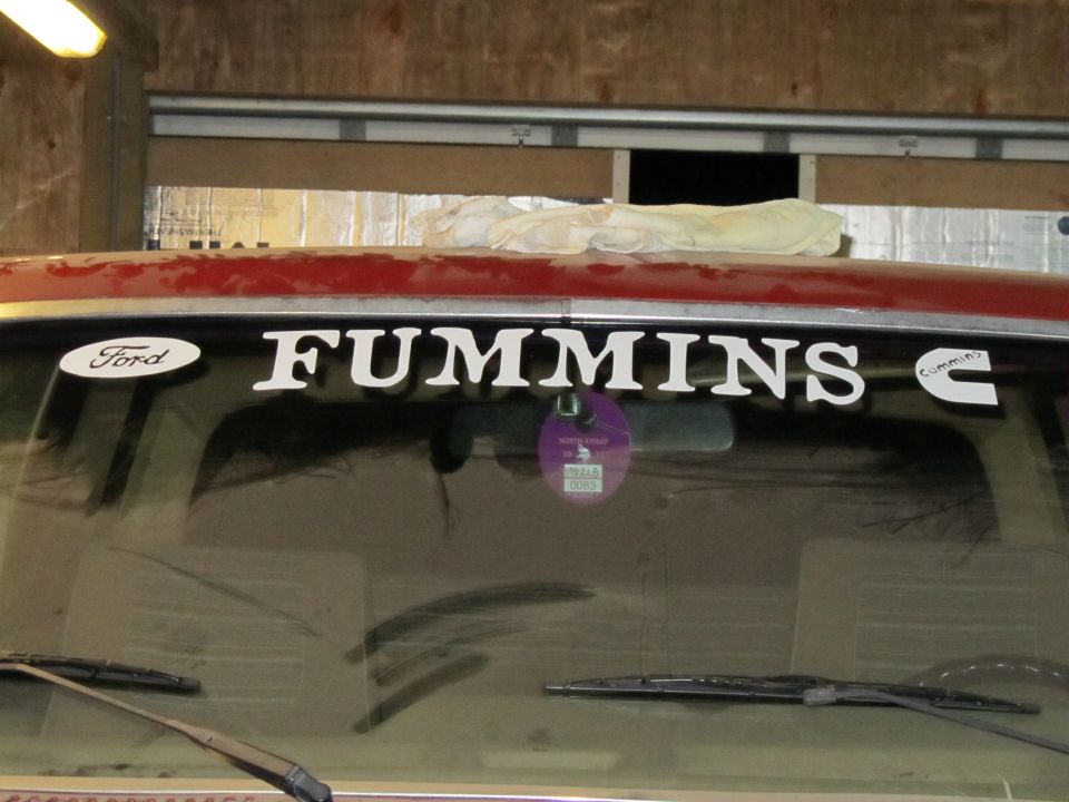 1984 Ford Bronco windshield with 'Ford' and 'Cummins' decals