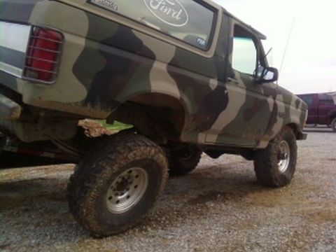 1995 Ford Bronco - This Ford Bronco is painted in a camouflage pattern and appears to be on a trailer.