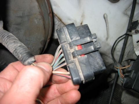 1992 Ford Bronco - A close-up view of a vehicle's wiring harness connector and its associated wires.