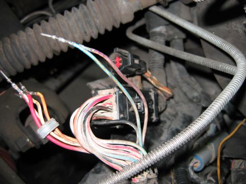 1992 Ford Bronco - This image shows a close-up view of a vehicle's electrical wiring harness and connectors.
