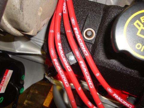 1989 Ford Bronco - Close-up of red Ford Racing spark plug wires and engine components.