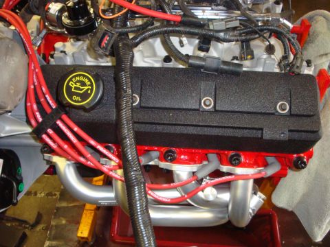 1989 Ford Bronco - Close-up of a Ford V8 engine, highlighting the spark plug wires and valve cover.