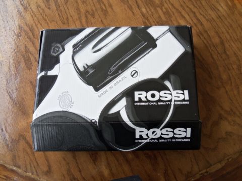 2000 Mercury Grand Marquis - The box displays a graphic of a Rossi revolver and text indicating "INTERNATIONAL QUALITY FIREARMS" and "MADE IN BRAZIL".