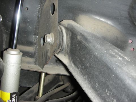 1998 Ford Crown Victoria - Close-up of a car's rear suspension component, showing part number 'DURAGO 125720'.