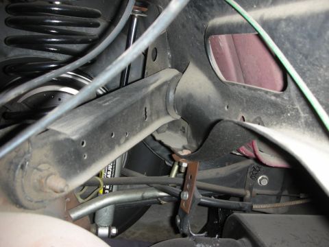 1998 Ford Crown Victoria - The image shows a detailed view of the rear suspension system, including the coil spring and shock absorber.