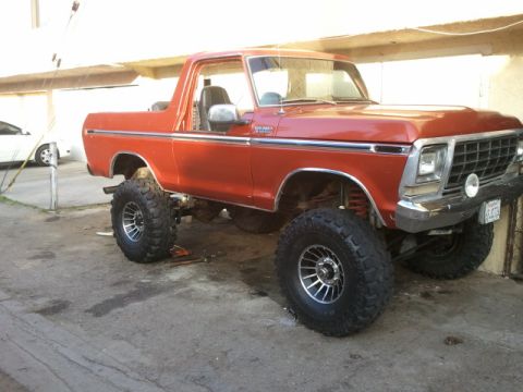 1978 Ford Bronco - This lifted 1978 Ford Bronco is parked outdoors, showing off its off-road capabilities.