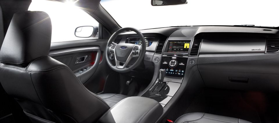 Interior view of a modern car with a touchscreen infotainment system and leather seats