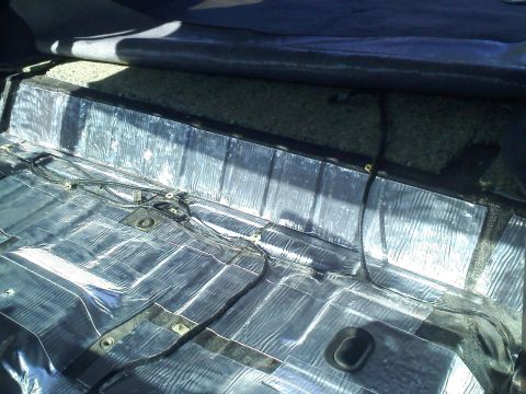 1994 Ford Bronco - Vehicle interior floor showing sound deadening material and wiring.