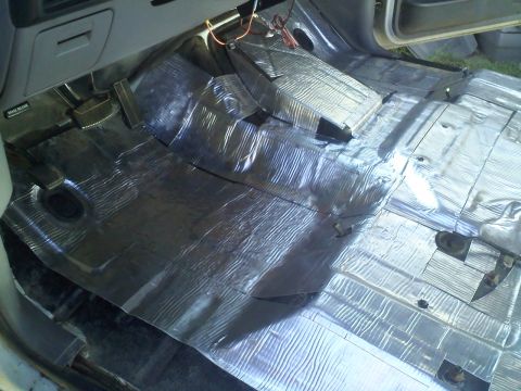 1994 Ford Bronco - The interior floor of a vehicle is covered in sound and heat insulation material.