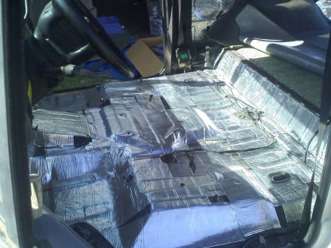 1994 Ford Bronco - Sound deadening material installed on the floor of a vehicle's interior.