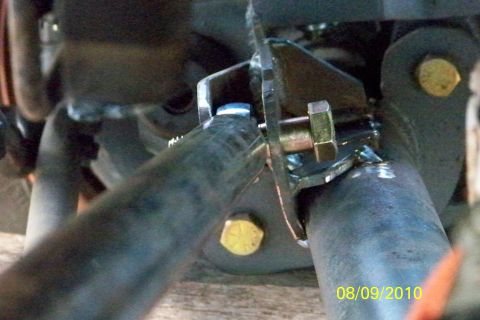1989 Ford Bronco - Custom axle modification with a bolt and bracket clearly visible, dated 08/09/2010.