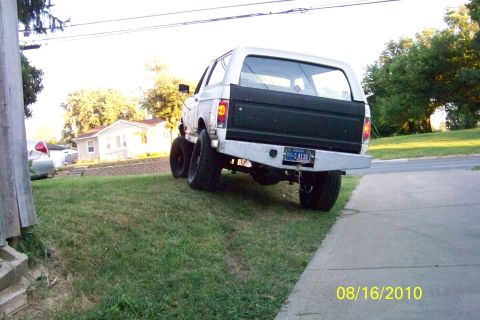 1989 Ford Bronco - This 1980s Ford Bronco has a custom rear bumper and a black panel insert on the tailgate.