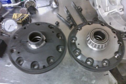 1999 Chevrolet Camaro - Close-up of differential gears and a bearing, with a dial indicator visible on the workbench.