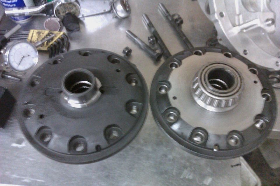 Differential gears and bearing on a workbench with a dial indicator
