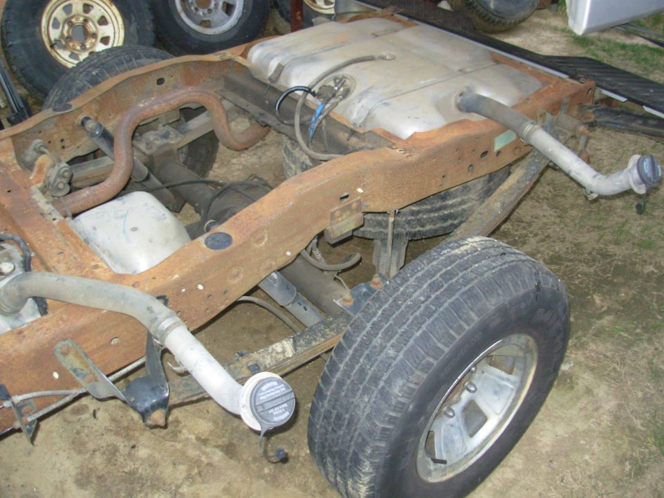 Rear chassis of a truck with fuel tank removed area and wheels