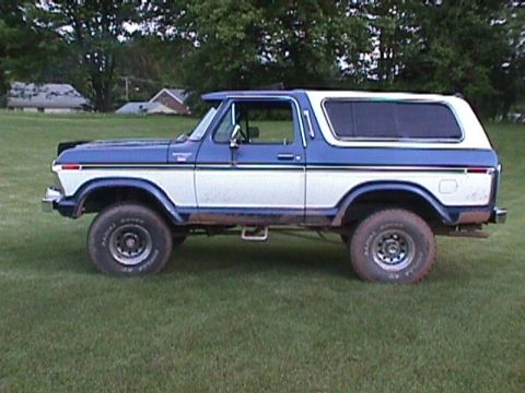 1978 Ford Bronco - Side view of a two-tone Ford Bronco with tinted rear windows.