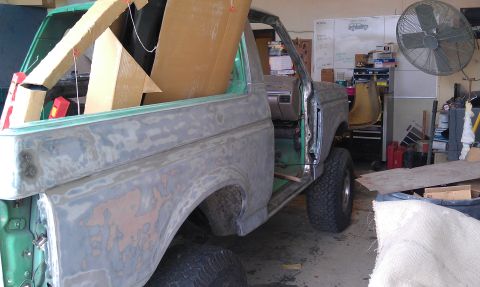 1995 Ford Bronco - This 1995 Ford Bronco is in a workshop, likely for bodywork and restoration.