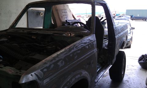 1995 Ford Bronco - This unfinished Ford Bronco is in primer and appears to be undergoing restoration.